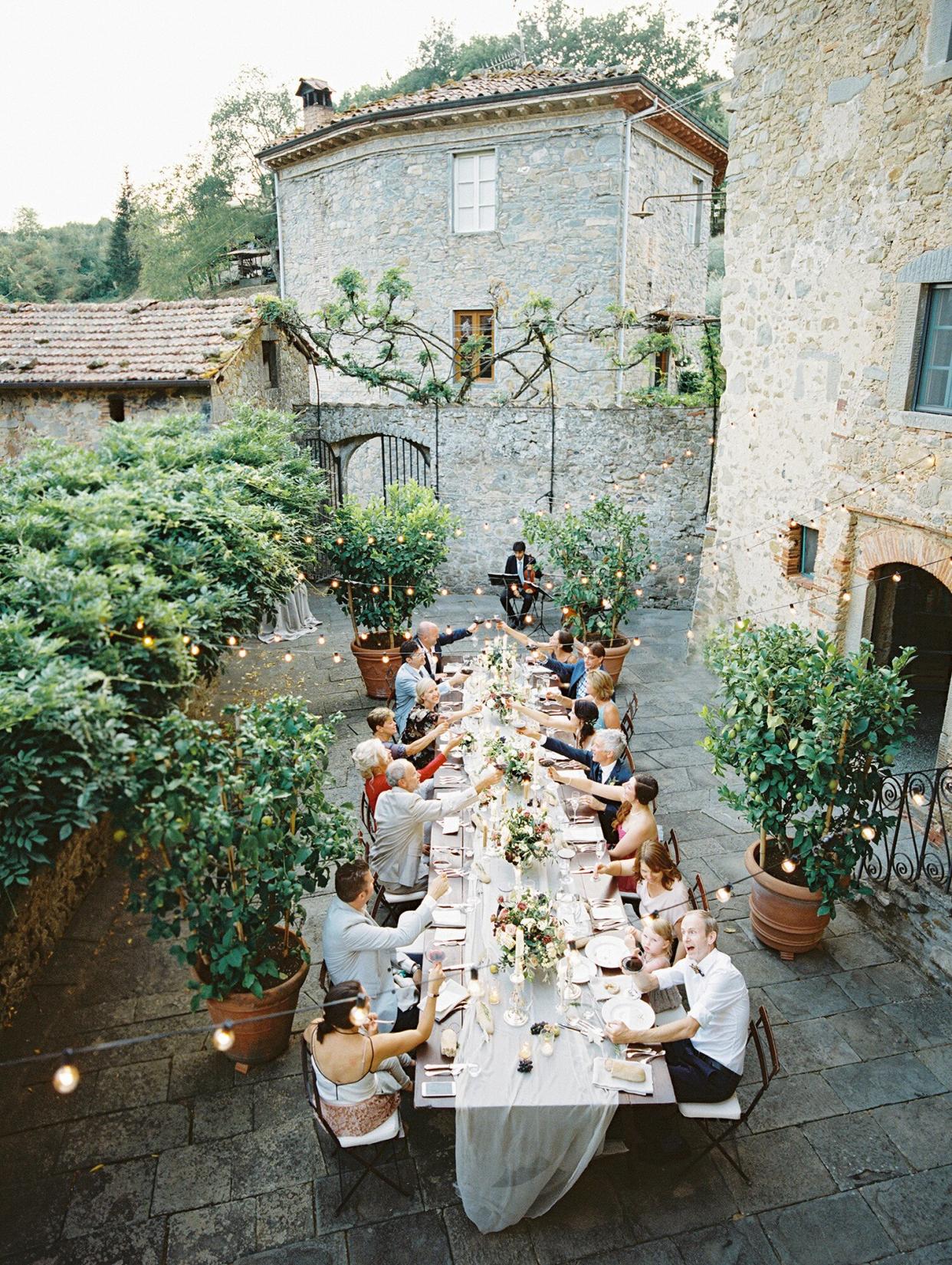 kelly pete wedding outdoor reception guests cheers