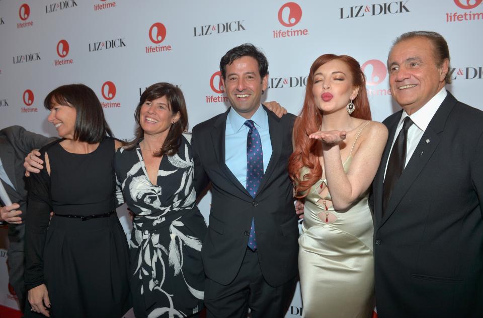 BEVERLY HILLS, CA - NOVEMBER 20: (L-R) Lifetime VP Original Movies Nancy Bennett, Lifetime SVP Original Movies Tanya Lopez, Lifetime EVP Programming Rob Sharenow, actress Lindsay Lohan, and executive producer Larry Thompson attends a private dinner for the Lifetime premier of "Liz & Dick" at Beverly Hills Hotel on November 20, 2012 in Beverly Hills, California. (Photo by Charley Gallay/Getty Images for A&E Networks)