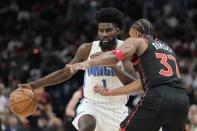 Orlando Magic forward Jonathan Isaac drives on Toronto Raptors guard Jahmi'us Ramsey (37) during the second half of an NBA basketball game Friday, March 15, 2024, in Toronto. (Frank Gunn/The Canadian Press via AP)