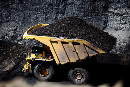 FILE PHOTO - Haul trucks move coal as seen during a tour of Peabody Energy's North Antelope Rochelle coal mine near Gillette, Wyoming, U.S. on June 1, 2016. The haul trucks operating at North Antelope Rochelle Mine hold 380 to 400 tons of material. REUTERS/Kristina Barker/File Photo
