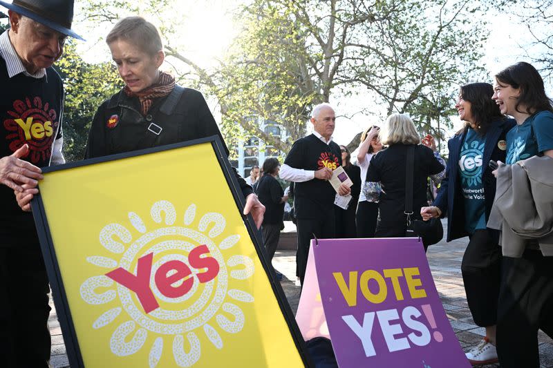 Former Prime Minister Malcolm Turnbull hands out Yes campaign material for the Voice in Kings Cross in Sydney