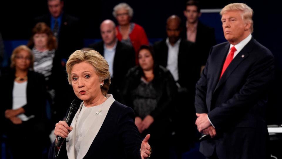 PHOTO: In this Oct. 9, 2016 file photo Republican nominee Donald Trump (R) watches Democratic nominee Hillary Clinton during the second presidential debate at Washington University in St. Louis. (Saul Loeb/POOL/AFP via Getty Images, FILE)