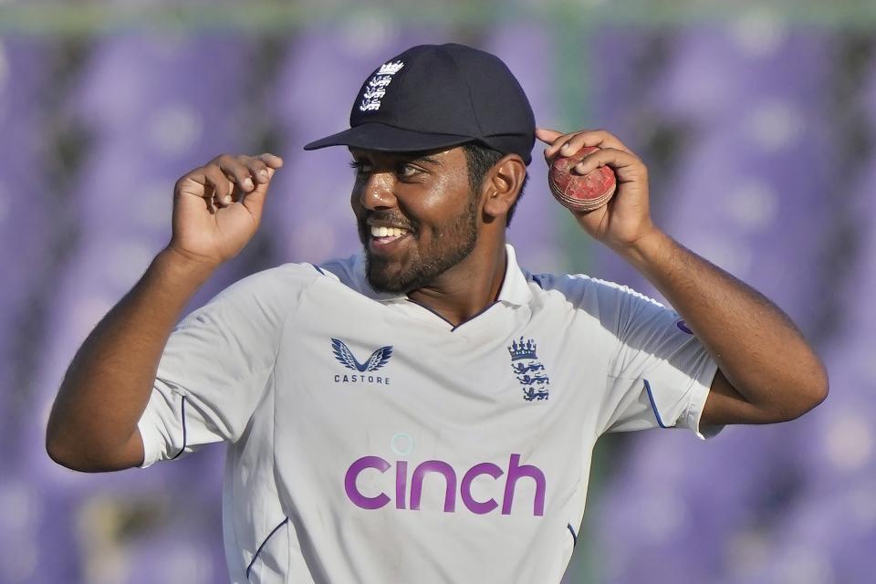 England's Rehan Ahmed smiles as he walks off the field on end of Pakistan second innings during the third day of third test cricket match between England and Pakistan, in Karachi, Pakistan, Monday, Dec. 19, 2022. (AP Photo/Fareed Khan)