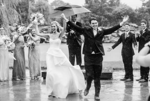"What do you do when a&nbsp;sudden downpour happens in the middle of your ceremony? You own it! It was stunning and SO memorable! " --&nbsp;<i>Sarah Libby</i>