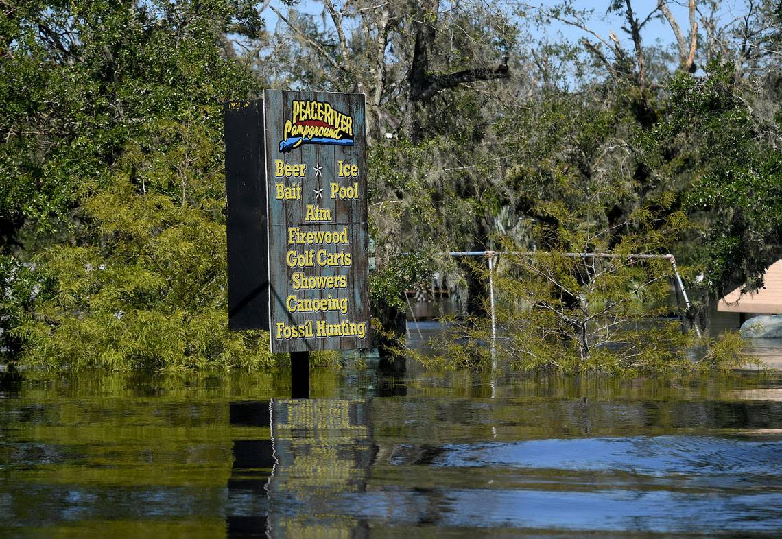 Peace River Campground sign sits in an area flooded by the Peace River in Arcadia on Sept. 30, 2022.