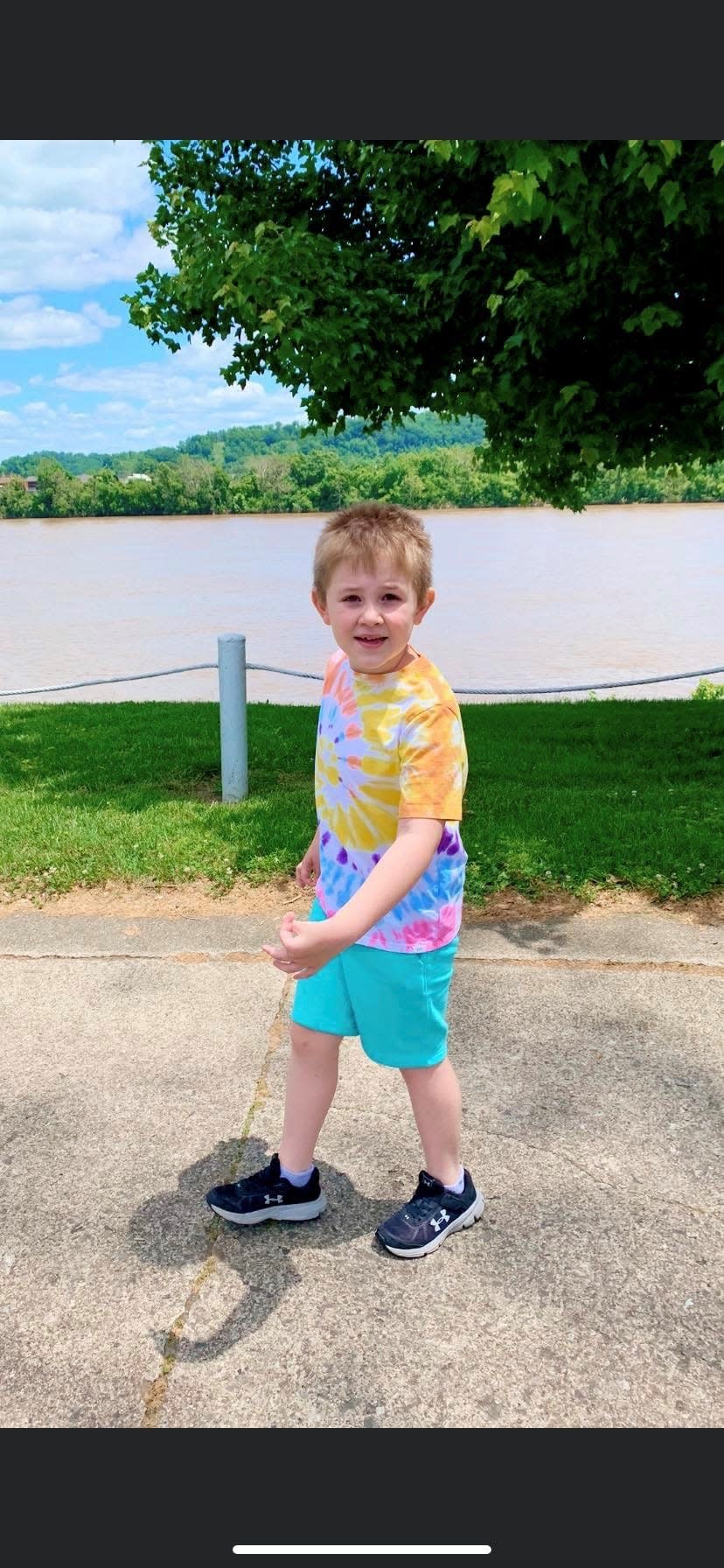 Quinn Howell, 6, of Russell, Ky., enjoys a walk along the Ohio River. Howell converted to telehealth therapy after the COVID-19 pandemic  limited access to in-person therapy.