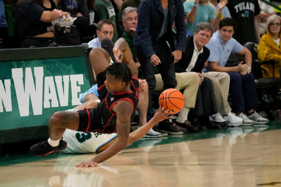 Tulane's Jalen Cook (3)  had a 25-point effort in their dramatic 90-89 overtime win in Memphis over the Tigers but had 11 turnovers and fouled out of the game.