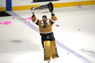 FILE - Vegas Golden Knights goaltender Adin Hill skates with the Stanley Cup after the Knights defeated the Florida Panthers 9-3 in Game 5 of the NHL hockey Stanley Cup Finals Tuesday, June 13, 2023, in Las Vegas. The Golden Knights winning the Stanley Cup with a veteran core and a journeyman goaltender shows the value of depth in hockey at every position, a model of consistency and a blueprint for other NHL championship contenders to follow. (AP Photo/Abbie Parr, File)