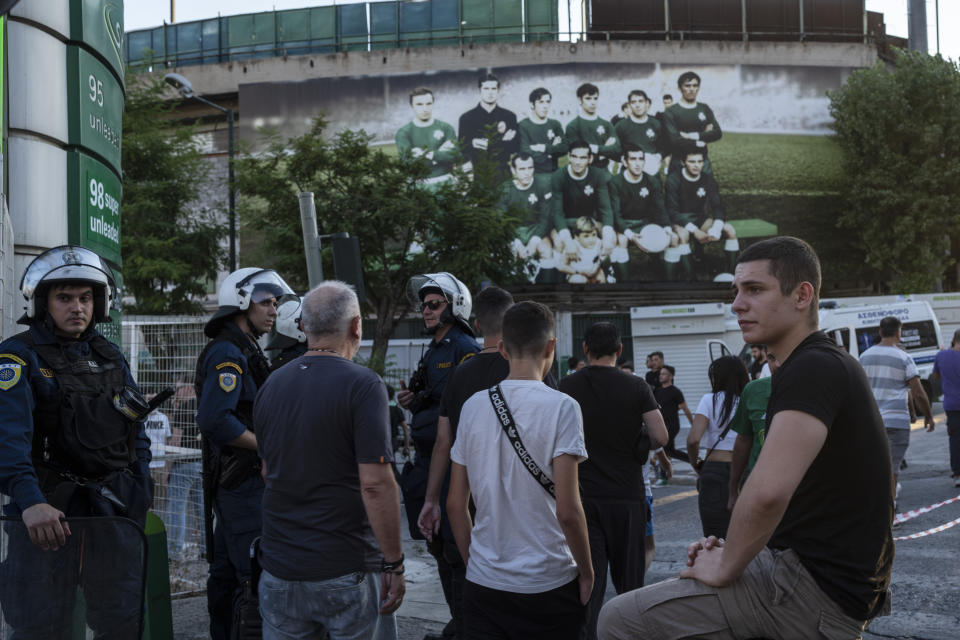 Riot Police stand guard outside the Leoforos stadium in Athens , on Wednesday, Aug. 9, 2023. Athens Panathinaikos faced Marseille Wednesday in a Champions League qualifier, which went ahead under strict security measures at Leoforos Stadium in the center of the Greek capital. In clashes late Monday in Athens, a 29-year-old Greek fan was stabbed to death outside AEK Athens' stadium, prompting the cancellation of a Champions League qualifier against Dinamo Zagreb. (AP Photo/Petros Giannakouris)