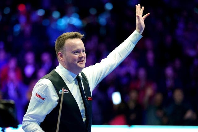 Murphy celebrates after defeating Robertson 6-4 on day one of the Cazoo Masters at Alexandra Palace (John Walton/PA).