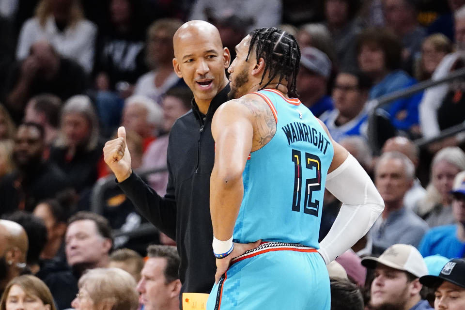 Phoenix Suns' head coach Monty Williams talks with Ish Wainwright (12) during the first half of an NBA basketball game against the Cleveland Cavaliers in Phoenix, Sunday, Jan. 8, 2023. (AP Photo/Darryl Webb)