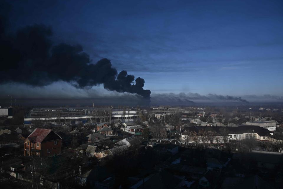 Black smoke rises from a military airport in Chuguyev near Kharkiv  on Feb. 24, 2022.