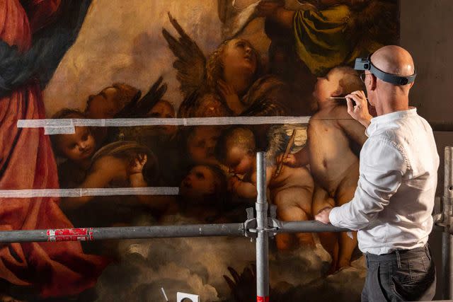 <p>Matteo De Fina/Courtesy of Save Venice</p> Conservator Giulio Bono working on site in the Basilica di Santa Maria Gloriosa dei Frari to restore Titian’s Assunta. Restoration was completed in October 2022.