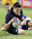 Scotland's Sean Maitland scores a try during the Rugby World Cup Pool A game at Kobe Misaki Stadium between Scotland and Samoa in Kobe, western Japan, Monday, Sept. 30, 2019. (Kyodo News via AP)