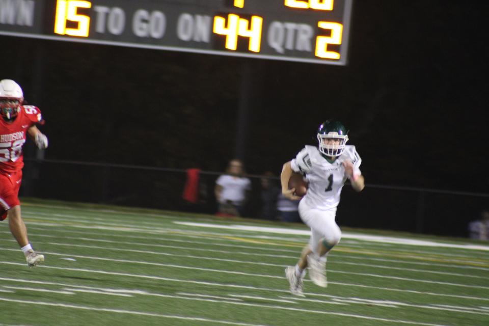 Sam Curtis makes a run in Oakmont's game against Hudson on Oct. 6, 2023. The Spartans were defeated 28-3.