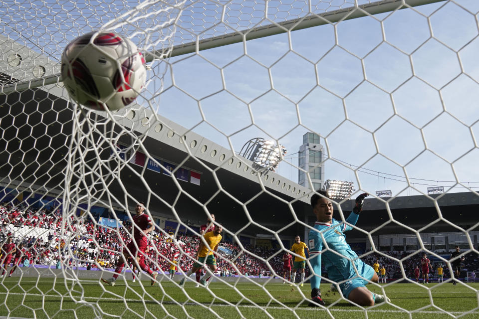 Indonesia's goalkeeper Ernando Ari Sutaryadi reacts after Australia's Martin Boyle scored his side's second goal during the Asian Cup round of 16 soccer match between Australia and Indonesia at Jassim Bin Hamad Stadium in Doha, Qatar, Sunday, Jan. 28, 2024. (AP Photo/Aijaz Rahi)