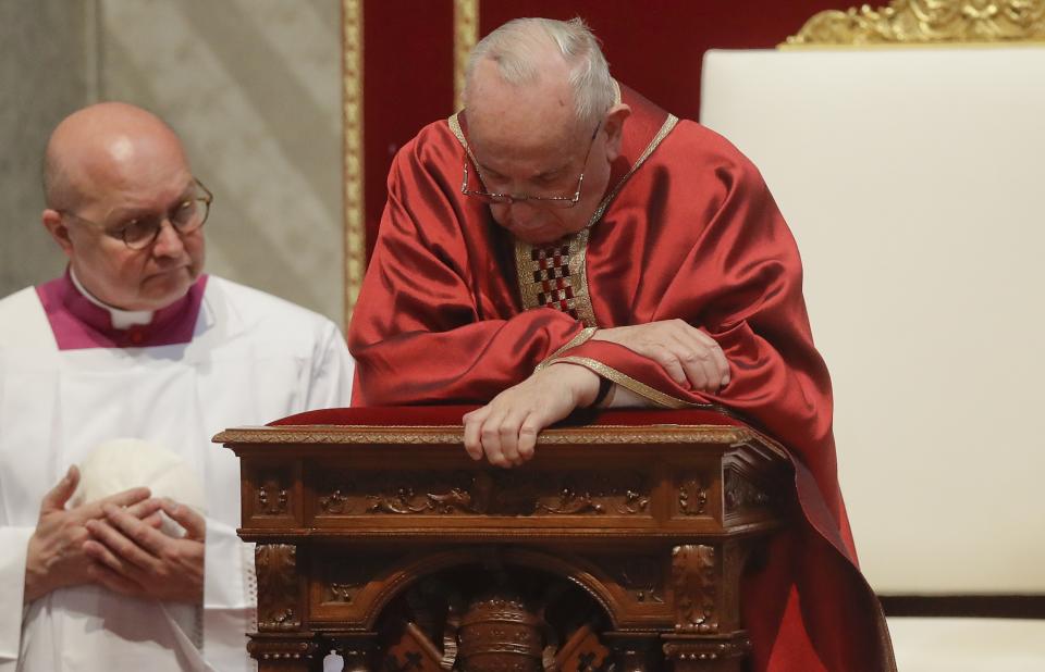 Pope Francis celebrates Mass for the Passion of Christ in St. Peter's Basilica, at the Vatican, Friday, April 19, 2019. Pope Francis began the Good Friday service at the Vatican with the Passion of Christ Mass and hours later will go to the ancient Colosseum in Rome for the traditional Way of the Cross procession. (AP Photo/Alessandra Tarantino)