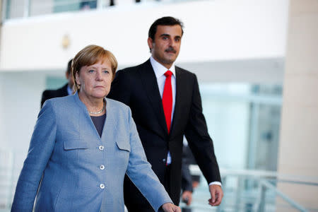 German Chancellor Angela Merkel and Qatar Emir Sheikh Tamim bin Hamad al-Thani attend a news conference in Berlin, Germany, September 15, 2017. REUTERS/Axel Schmidt