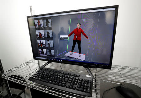 Animation of a visitor is seen on a monitor as she is scanned to add her images to an animation during the Tokyo 2020 Japan House media preview in Gangneung, South Korea, February 8, 2018. REUTERS/Jorge Silva