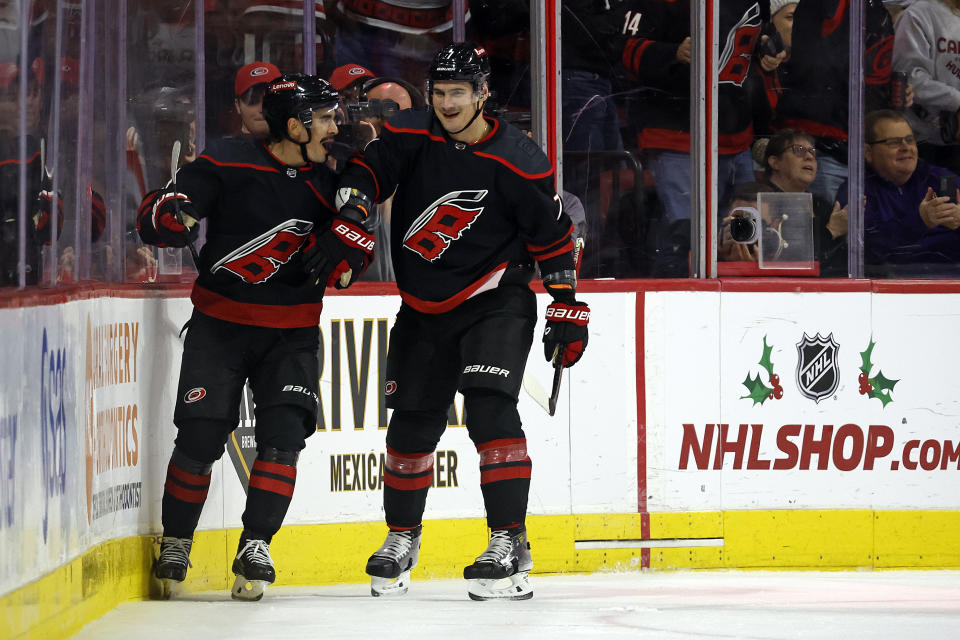 Carolina Hurricanes' Seth Jarvis, left, celebrates his goal with teammate Dmitry Orlov during the first period of an NHL hockey game against the Edmonton Oilers in Raleigh, N.C., Wednesday, Nov. 22, 2023. (AP Photo/Karl B DeBlaker)