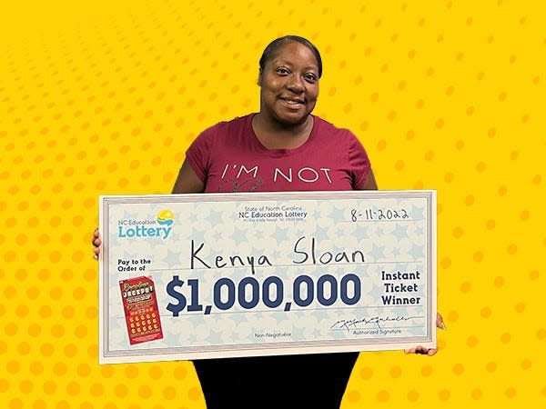 Kenya Sloan of Shelby picks up her $1 million lottery win at the North Carolina Education Lottery headquarters in Raleigh.