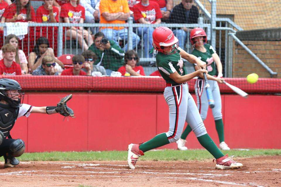 Porter Gregory has a charge in her bat for Oak Harbor.