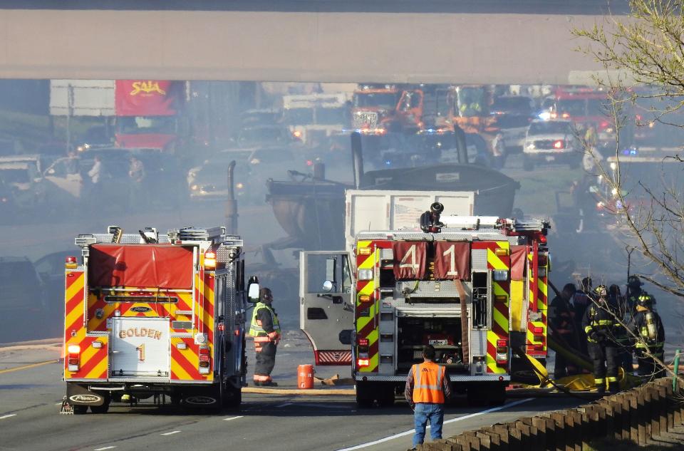 Emergency crews work at the scene of a deadly collision on Interstate 70 near the Colorado Mills Parkway in Lakewood, Colo.  April 25, 2019.