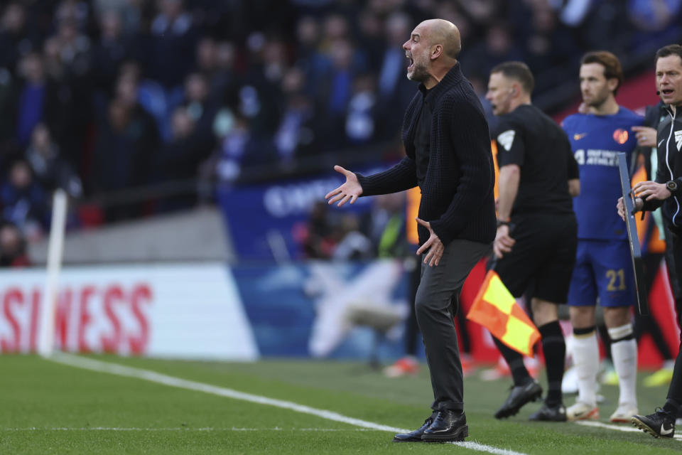 Manchester City's head coach Pep Guardiola yells during the English FA Cup semifinal soccer match between Manchester City and Chelsea at Wembley stadium in London, Saturday, April 20, 2024. (AP Photo/Ian Walton)