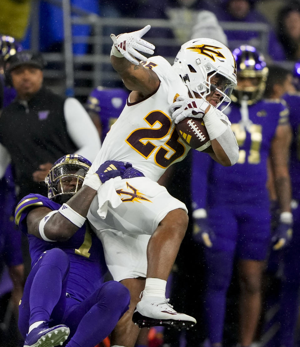 Arizona State running back DeCarlos Brooks (25) is brought down by Washington cornerback Dominique Hampton (7) during the first half of an NCAA college football game Saturday, Oct. 21, 2023, in Seattle. (AP Photo/Lindsey Wasson)