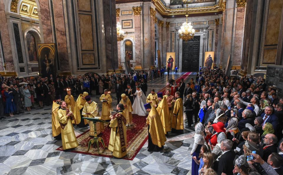 Grand Duke George Mikhailovich Romanov and Victoria Romanovna Bettarini attend their wedding ceremony at the Saint Isaac's Cathedral in Saint Petersburg, on October 1, 2021. - Russia was to hold its first royal wedding, on October 1, 2021, since the 1917 Bolshevik revolution toppled the Romanov monarchy, with royals from across Europe expected at the lavish ceremony. Grand Duke George Mikhailovich Romanov, 40, and his Italian fiance Rebecca Virginia Bettarini, 39, will say their vows at the Saint Isaac's cathedral in the former imperial capital Saint Petersburg in the presence of dozens of royals. (Photo by Olga MALTSEVA / AFP) (Photo by OLGA MALTSEVA/AFP via Getty Images)