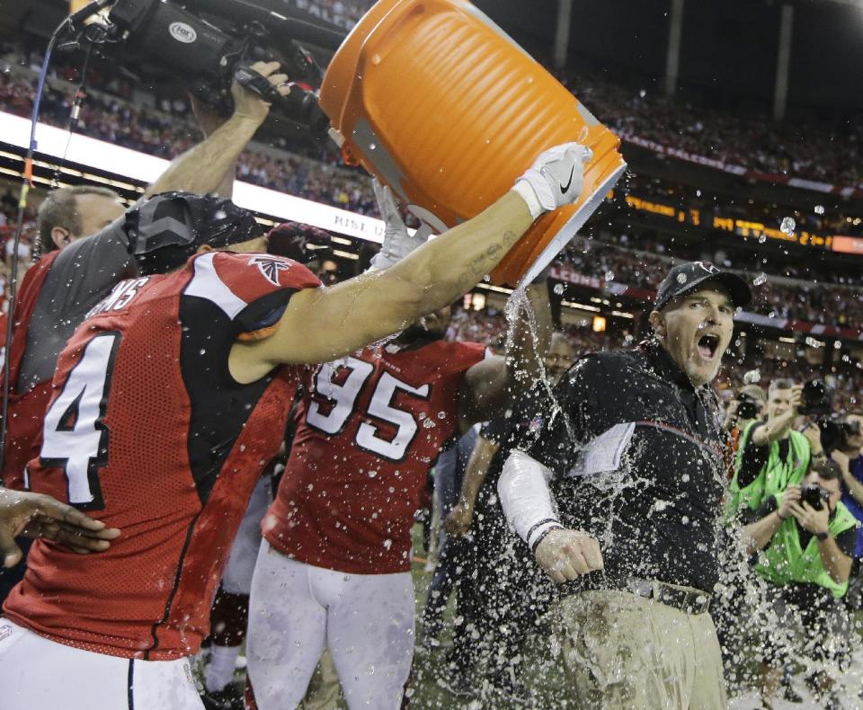 Atlanta Falcons head coach Dan Quinn reacts as he is dunked after the NFL football NFC championship game against the Green Bay Packers Sunday, Jan. 22, 2017, in Atlanta. The Falcons won 44-21 to advance to Super Bowl LI. (AP Photo/Mark Humphrey)