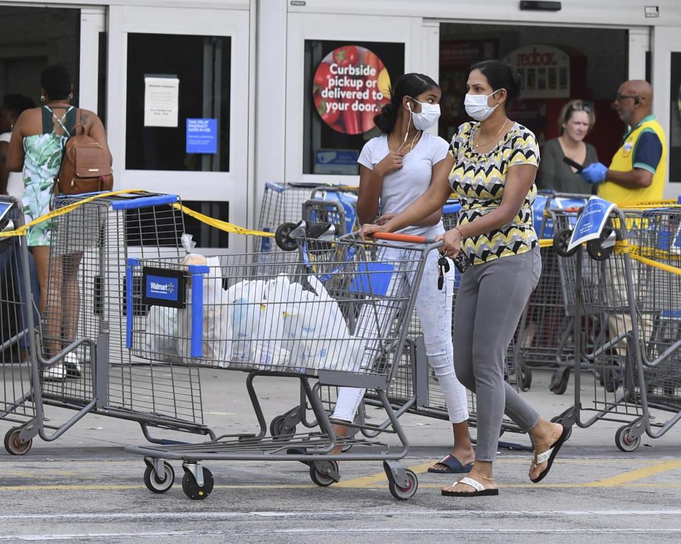 COCONUT CREEK, FL - APRIL 04: Shoppers stock up as Walmart on Saturday began limiting the number of customers who can be in it's stores at once due to the Coronavirus (COVID-19) pandemic on April 4, 2020 in Coconut Creek, Florida Credit: mpi04/MediaPunch /IPX