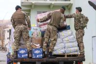 <p>British troops from 40 Commando prepare aid for distribution, on the British Virgin Islands, Road Town, Virgin Islands , Sept. 18, 2017. Royal Marines from 40 Commando have been ensuring aid reaches people across the island before Storm Maria arrives. (Photo: Photo by LPhot Joel Rouse/Handout/EPA-EFE/REX/Shutterstock) </p>