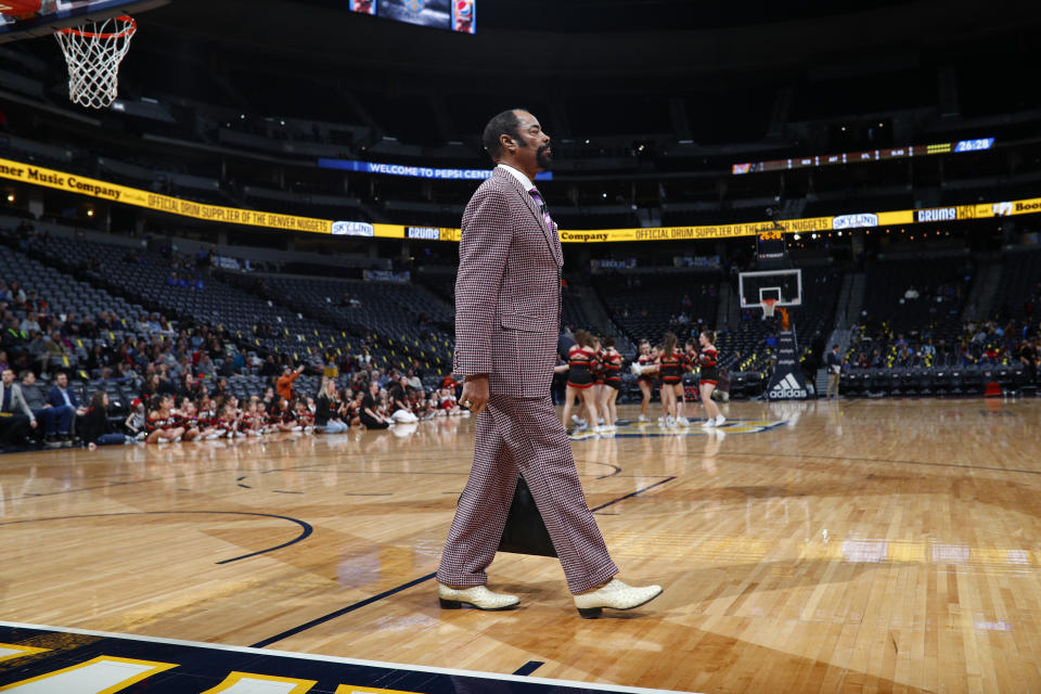 New York Knicks television color analyst Walt Frazier in the second half of an NBA basketball game Thursday, Jan. 25, 2018, in Denver. The Nuggets won 130-118. (AP Photo/David Zalubowski)