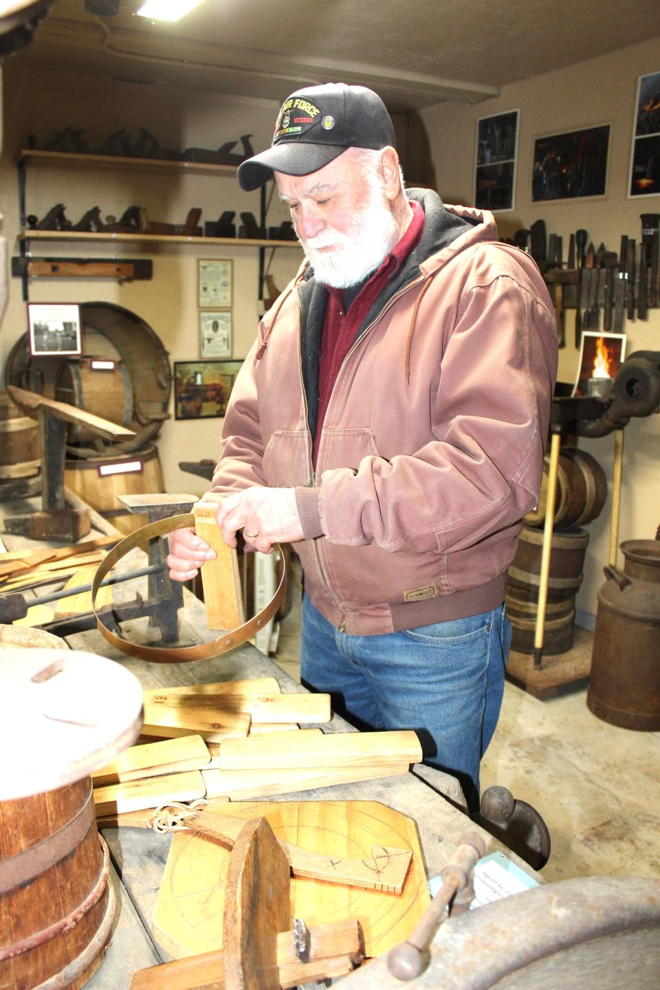 Fred Will of Somerset area works on some old keeler buckets at Wagner's Sugar Camp during last year's Maple Tour.