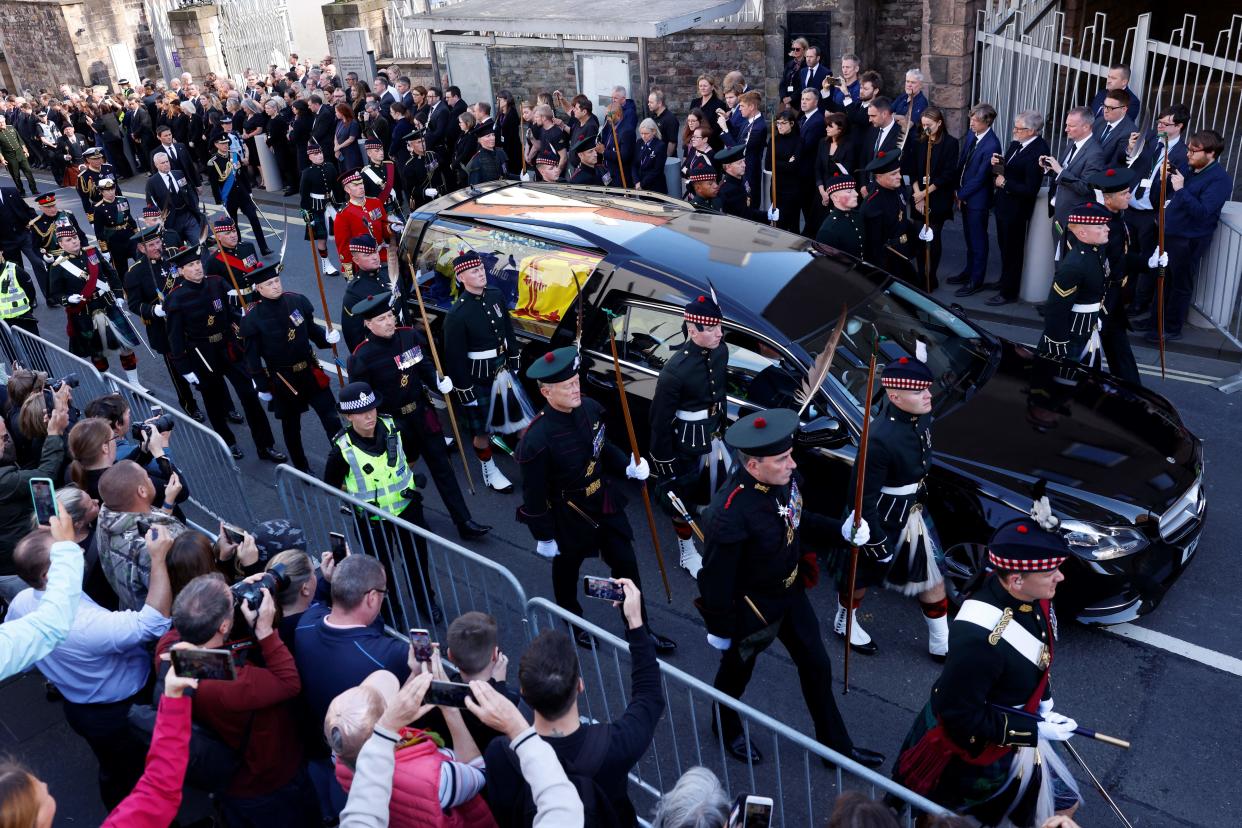 Britain's King Charles III (L), flanked by Britain's Princess Anne, Princess Royal, Britain's Prince Andrew, Duke of York and Britain's Prince Edward, Earl of Wessex walk behind the procession of Queen Elizabeth II's coffin, from the Palace of Holyroodhouse to St Giles Cathedral, on the Royal Mile on September 12, 2022, where Queen Elizabeth II will lie at rest. - Mourners will on Monday get the first opportunity to pay respects before the coffin of Queen Elizabeth II, as it lies in an Edinburgh cathedral where King Charles III will preside over a vigil. (Photo by Odd ANDERSEN / POOL / AFP) (Photo by ODD ANDERSEN/POOL/AFP via Getty Images)