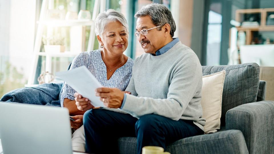 Shot of a mature couple going through paperwork together at home