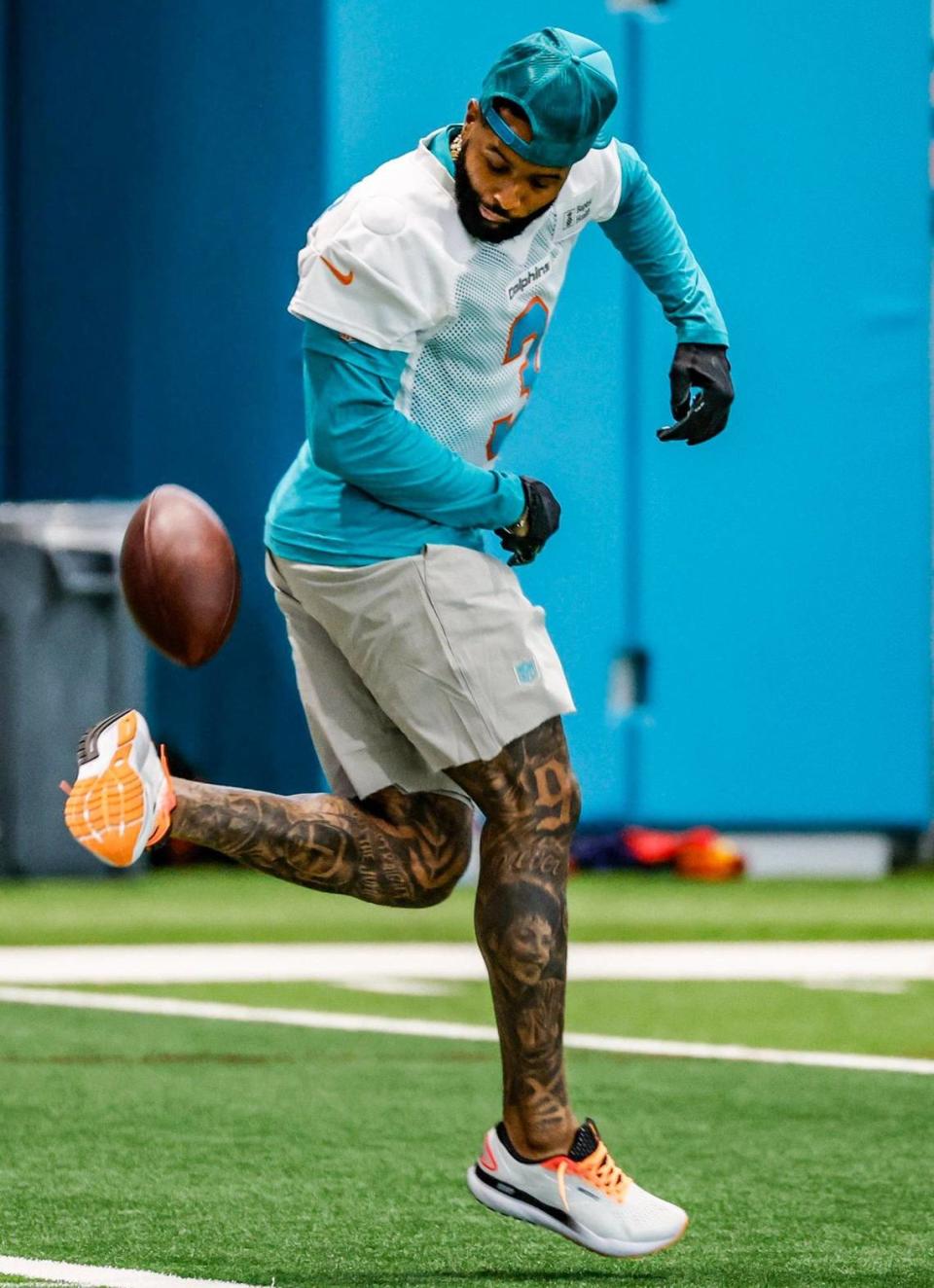 Miami Dolphins wide receiver Odell Beckham Jr. (3) kicks a football during practice at the Baptist Health Training Complex in Miami Gardens, Florida on Wednesday, June 5, 2024.