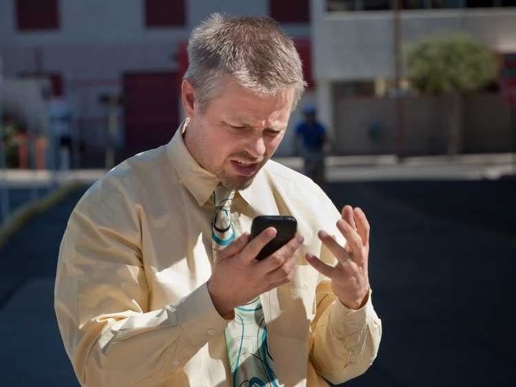 man frustrated with phone