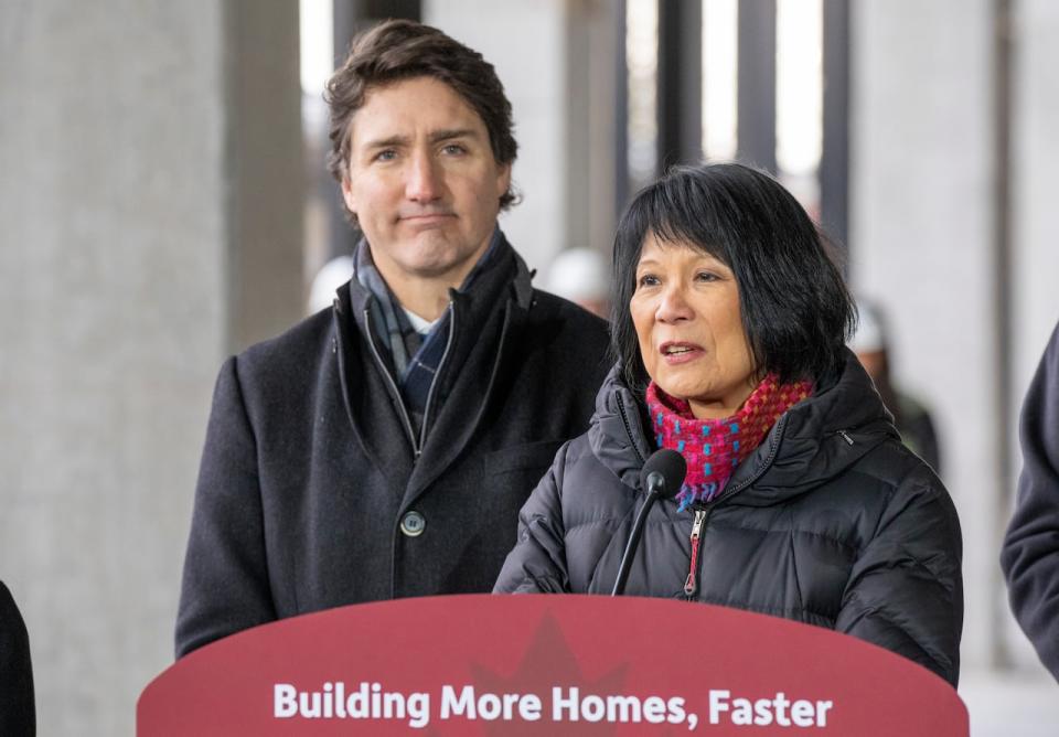 Prime Minister Justin Trudeau (left) listens as Toronto Mayor Olivia Chow speaks at at an announcement in Toronto on Dec. 21, 2023. (Frank Gunn/The Canadian Press - image credit)