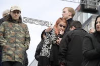 A couple embrace after a truck crashed into a department store injuring several people in central Stockholm, Sweden, Friday April 7, 2017. Swedish Prime Minister Stefan Lofven says everything indicates a truck that has crashed into a major department store in downtown Stockholm is "a terror attack." (Anders Wiklund/ TT News Agency via AP)