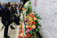 People attend a ceremony at the Maelbeek metro station to commemorate two years since bombings at Brussels airport and a metro station, in Brussels, Belgium March 22, 2018. Olivier Hoslet/Pool via REUTERS
