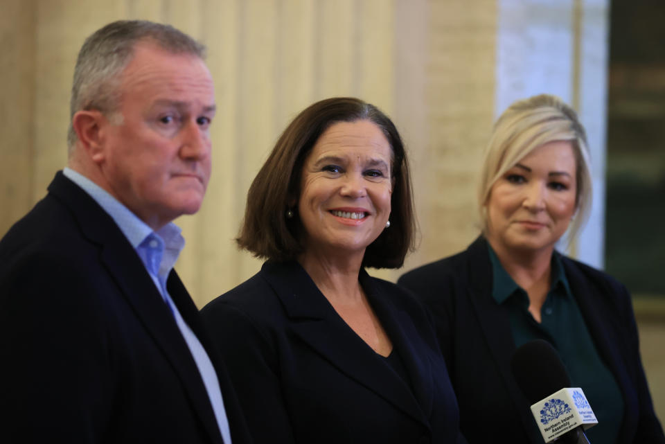 Sinn Fein MLA Conor Murphy, left, party president Mary Lou McDonald, centre, and vice-president Michelle O'Neill, right, at Stormont on Tuesday. (PA)