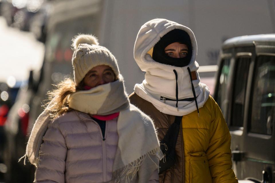 People walk in freezing cold temperatures on Feb. 4, 2023, in New York City.