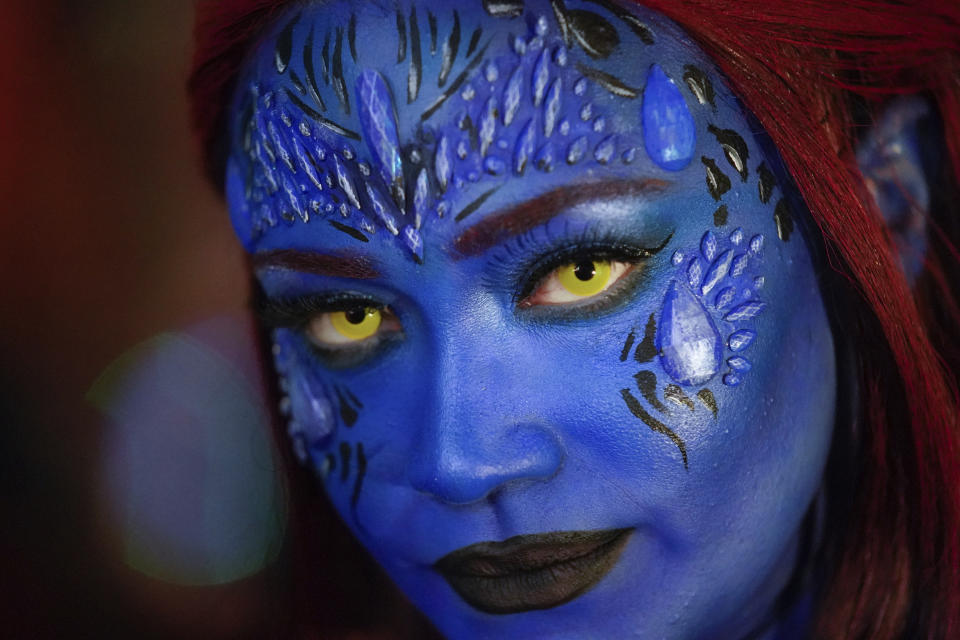 A reveler marches in the Greenwich Village Halloween Parade, late Monday, Oct. 31, 2022, in New York. (AP Photo/Julia Nikhinson)