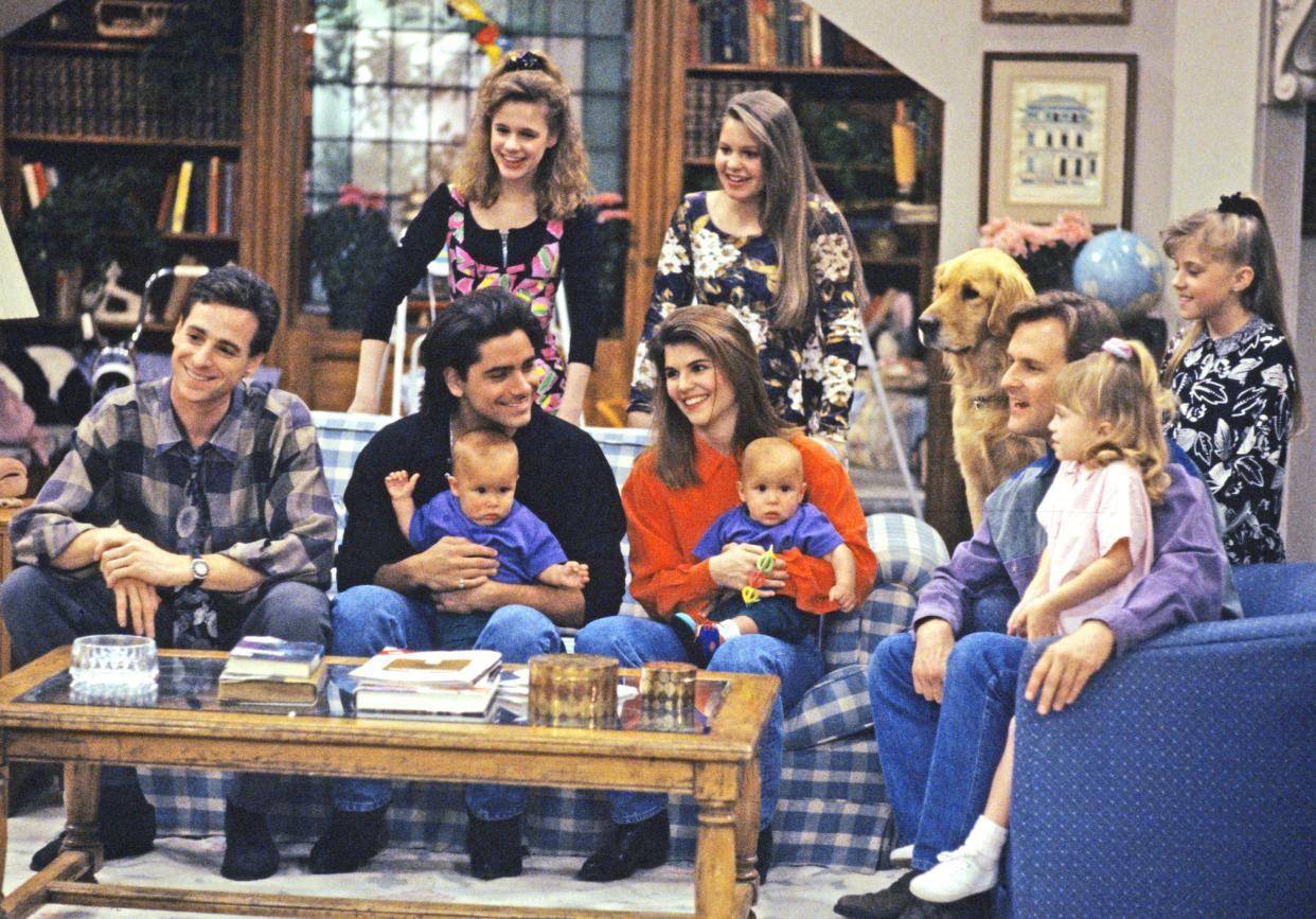 Pictured, from left: Danny (Bob Saget), Kimmy (Andrea Barber), D.J. (Candace Cameron), Jesse and Becky (John Stamos and Lori Loughlin, holding twin sons Nicky and Alex, played by twins Blake/Dylan Tuomy-Wilhoit), Comet (dog), Joey (Dave Coulier), Michelle (Mary Kate/Ashley Olsen) and Stephanie (Jodie Sweetin) watched Jesse's video on MTV during an episode of "Full House" Season 5 on May 12, 1992.