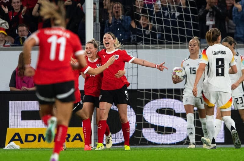 Austria's Eileen Campbell (C) celebrates after scoring her side's first goal during the UEFA Women's Euro 2025 qualifying soccer match between Austria and Germany at Raiffeisen Arena. Expa/Reinhard Eisenbauer/APA/dpa