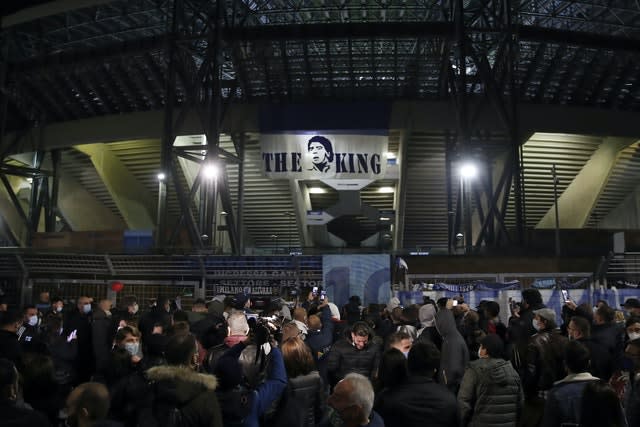 People gather outside Napoli's San Paolo Stadium to remember Diego Maradona 