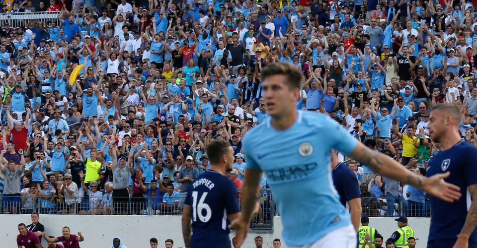 John Stones celebrates scoring against Tottenham