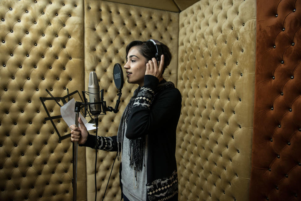 <p>Hadeel Fawzy Abushar 25 records a song in a studio in Gaza City. Few female singers remain as families and local government look down on the practice. Hadeel started when she was 12, as all of her sisters are singers. (Photograph by Monique Jaques) </p>